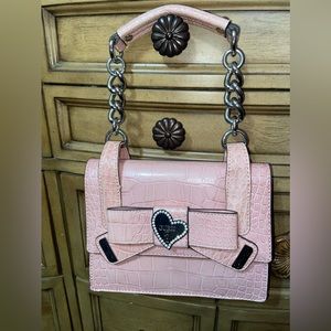 Mini 👜 in rose color. New, never used. No damages.